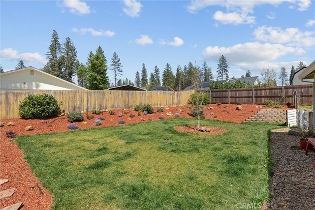 view of yard featuring a fenced backyard