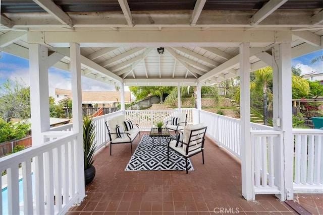 view of patio featuring an outdoor hangout area and a gazebo