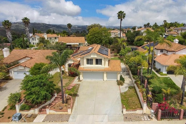 birds eye view of property with a residential view