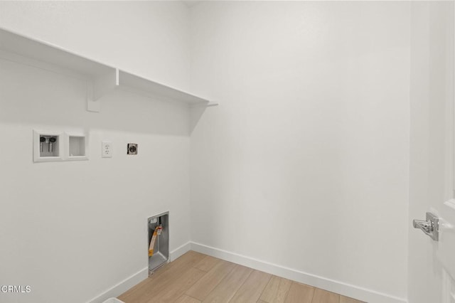 clothes washing area featuring laundry area, washer hookup, baseboards, light wood-type flooring, and hookup for an electric dryer
