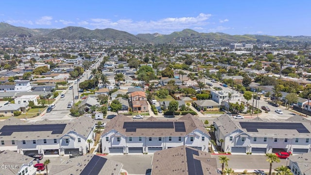 drone / aerial view with a residential view and a mountain view