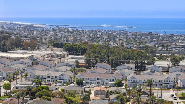 birds eye view of property featuring a water view and a residential view