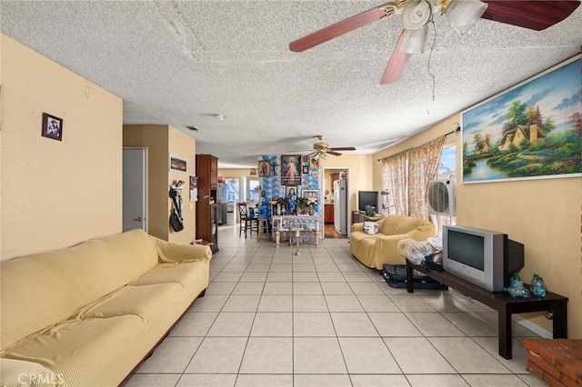12597 Jalepeno Ave, Chino, CA 91710 - living room featuring a ceiling fan, plenty of natural light, light tile patterned floors, and a textured ceiling