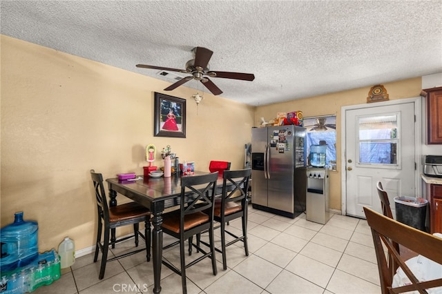 12597 Jalepeno Ave, Chino, CA 91710 - dining area featuring light tile patterned flooring, ceiling fan, a textured ceiling, and baseboards
