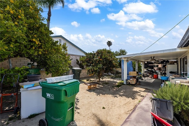 12597 Jalepeno Ave, Chino, CA 91710 - view of yard with a ceiling fan, a patio, and fence