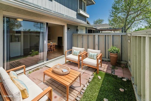view of patio featuring an outdoor hangout area and a fenced backyard