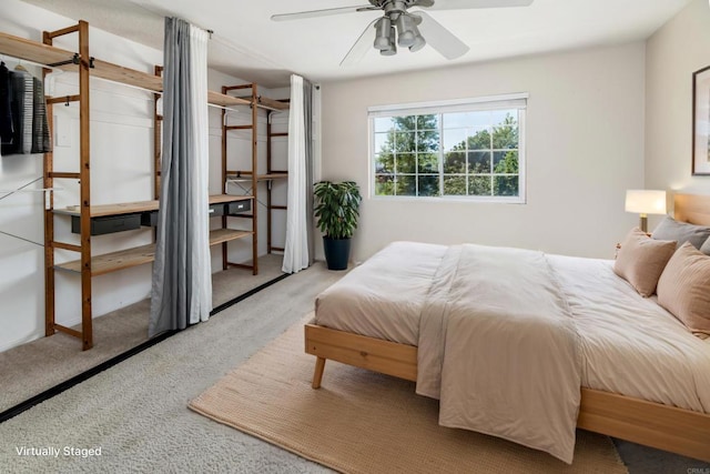 carpeted bedroom with ceiling fan