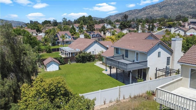 drone / aerial view with a residential view and a mountain view