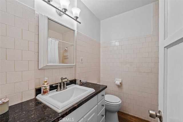 2218 Ximeno Ave, Long Beach, CA 90815 - bathroom with tile walls, vanity, a shower with curtain, wood finished floors, and backsplash
