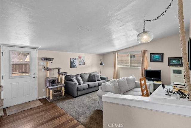2218 Ximeno Ave, Long Beach, CA 90815 - living room featuring wood finished floors, vaulted ceiling, and healthy amount of natural light
