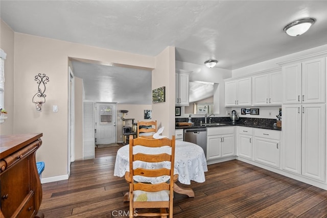 2218 Ximeno Ave, Long Beach, CA 90815 - kitchen featuring dishwasher, dark wood-type flooring, white cabinets, dark countertops, and plenty of natural light