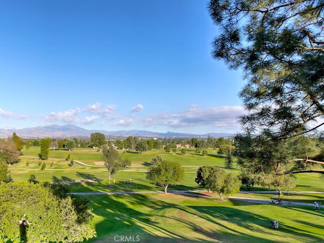 2390 Via Mariposa W Unit 2E, Laguna Woods, CA 92637 - view of home's community featuring a mountain view, golf course view, and a yard