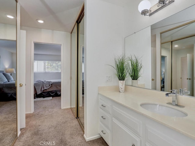2390 Via Mariposa W Unit 2E, Laguna Woods, CA 92637 - bathroom featuring carpet flooring, recessed lighting, ensuite bathroom, and vanity