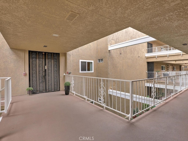 2390 Via Mariposa W Unit 2E, Laguna Woods, CA 92637 - view of patio / terrace featuring visible vents and a balcony