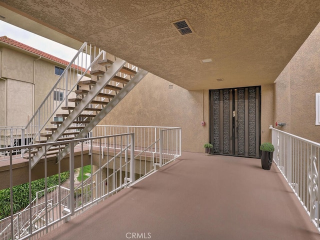 2390 Via Mariposa W Unit 2E, Laguna Woods, CA 92637 - exterior space featuring visible vents and stairs