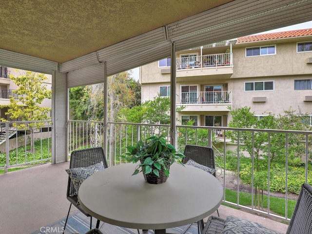 2390 Via Mariposa W Unit 2E, Laguna Woods, CA 92637 - sunroom / solarium with outdoor dining space