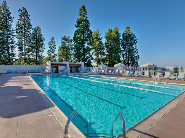 2390 Via Mariposa W Unit 2E, Laguna Woods, CA 92637 - community pool featuring fence