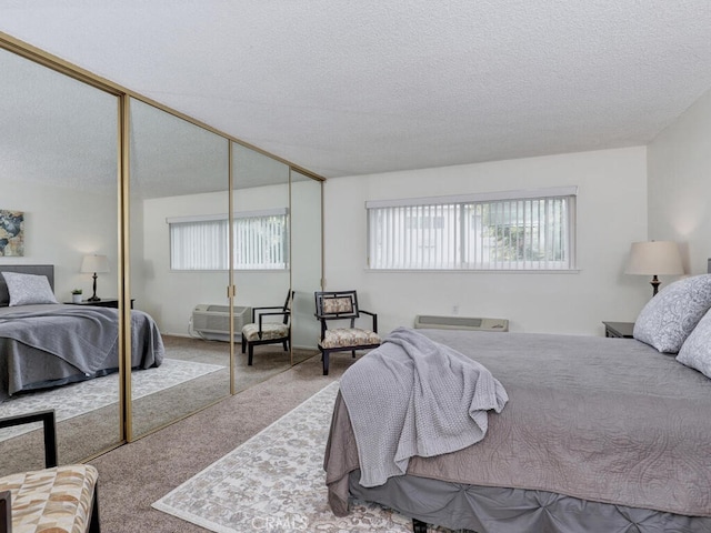 2390 Via Mariposa W Unit 2E, Laguna Woods, CA 92637 - carpeted bedroom featuring a textured ceiling and a closet