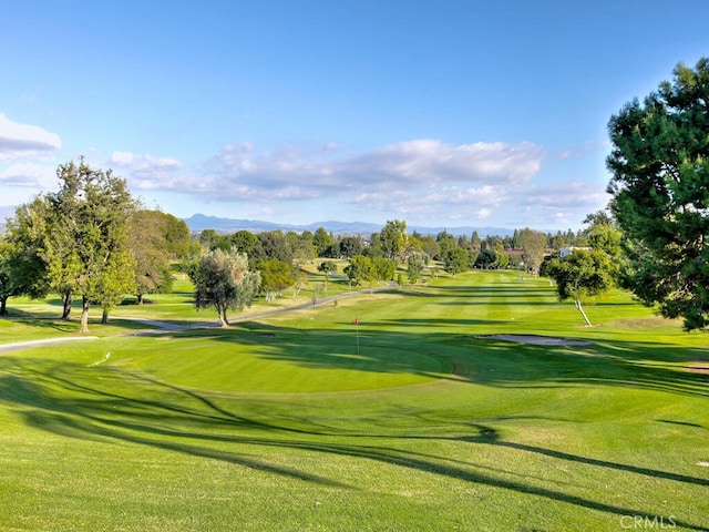 2390 Via Mariposa W Unit 2E, Laguna Woods, CA 92637 - view of property's community featuring a yard, a mountain view, and golf course view