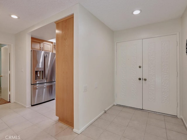 2390 Via Mariposa W Unit 2E, Laguna Woods, CA 92637 - interior space with light tile patterned floors, recessed lighting, a textured ceiling, and baseboards