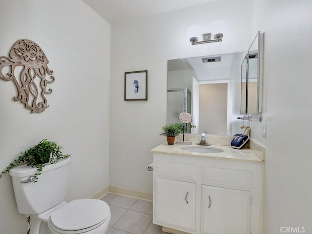 2390 Via Mariposa W Unit 2E, Laguna Woods, CA 92637 - bathroom featuring tile patterned floors, toilet, vanity, baseboards, and visible vents