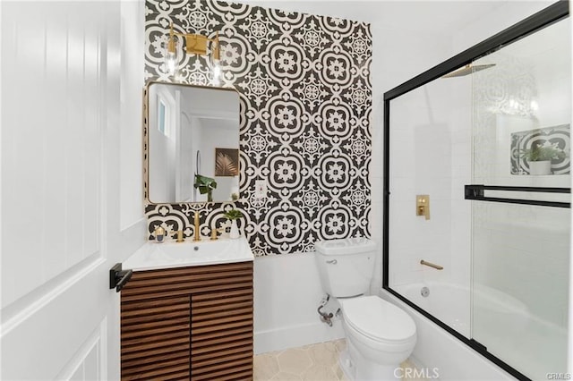 11445 Saticoy St, North Hollywood, CA 91605 - bathroom with toilet, vanity, bath / shower combo with glass door, baseboards, and tile patterned floors