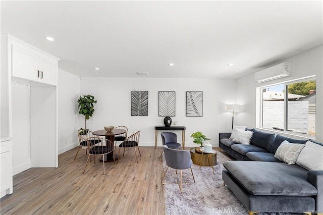 11445 Saticoy St, North Hollywood, CA 91605 - living room featuring a wall mounted AC, light wood-style flooring, recessed lighting, and baseboards