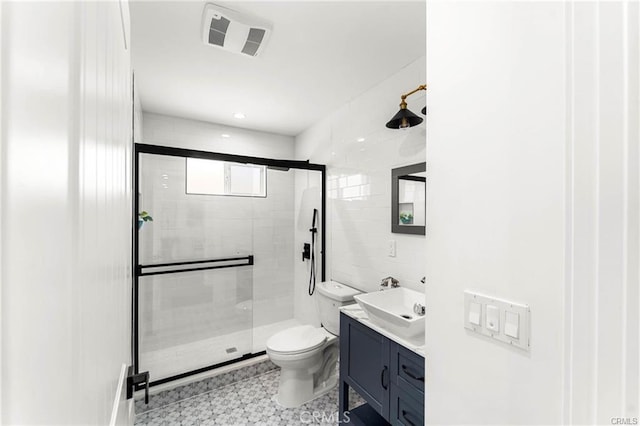 11445 Saticoy St, North Hollywood, CA 91605 - full bathroom with toilet, vanity, a shower stall, and tile patterned floors