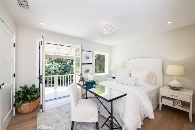 567 Flora St, Laguna Beach, CA 92651 - bedroom featuring visible vents, light wood-type flooring, access to exterior, and recessed lighting