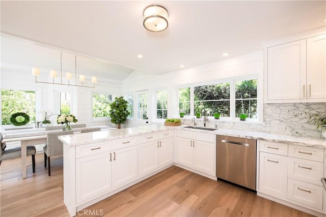 567 Flora St, Laguna Beach, CA 92651 - kitchen with plenty of natural light, dishwasher, lofted ceiling, and a sink