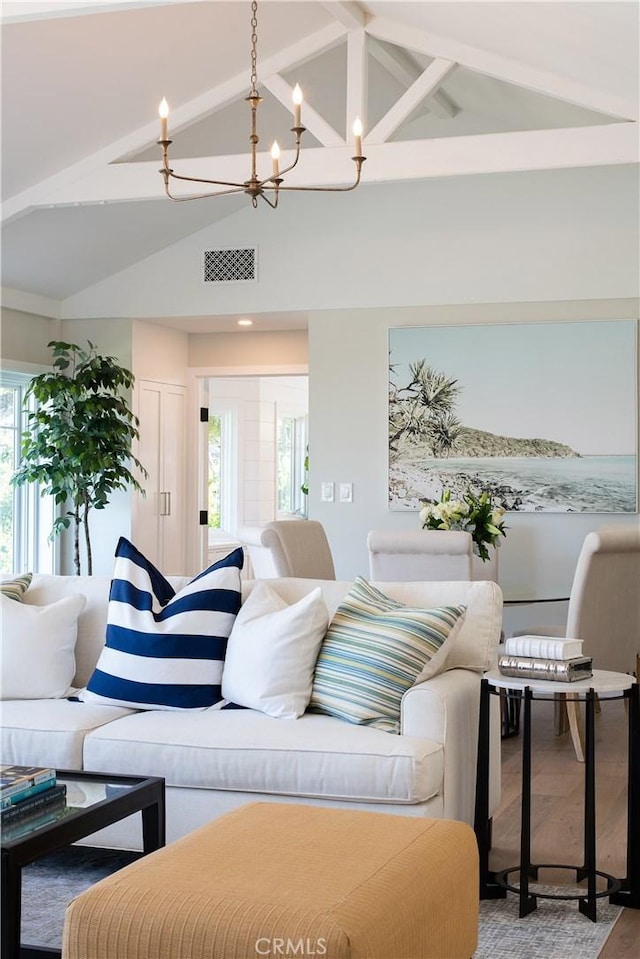 567 Flora St, Laguna Beach, CA 92651 - living area featuring a chandelier, visible vents, beamed ceiling, and high vaulted ceiling