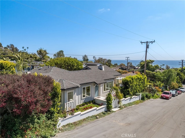 567 Flora St, Laguna Beach, CA 92651 - view of front of home featuring board and batten siding and roof with shingles