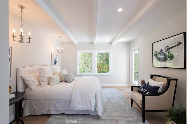 567 Flora St, Laguna Beach, CA 92651 - bedroom featuring beamed ceiling, an inviting chandelier, wood finished floors, and multiple windows