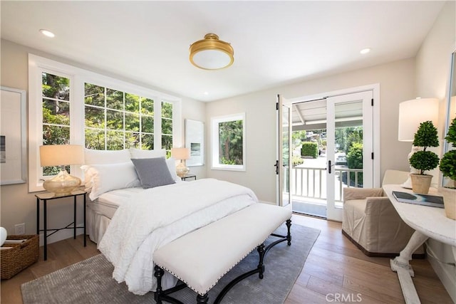 567 Flora St, Laguna Beach, CA 92651 - bedroom with recessed lighting, access to exterior, and wood finished floors
