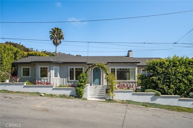 567 Flora St, Laguna Beach, CA 92651 - ranch-style home featuring roof with shingles, board and batten siding, and a chimney