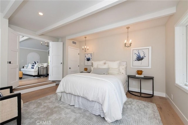 567 Flora St, Laguna Beach, CA 92651 - bedroom with baseboards, recessed lighting, an inviting chandelier, beam ceiling, and light wood-type flooring
