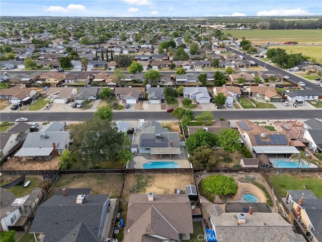 1045 Clover Ln, Hanford, CA 93230 - aerial view of property and surrounding area with a pool area and nearby suburban area