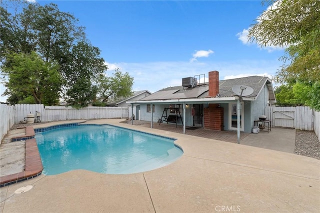 1045 Clover Ln, Hanford, CA 93230 - view of pool with a patio, central air condition unit, and a fenced backyard