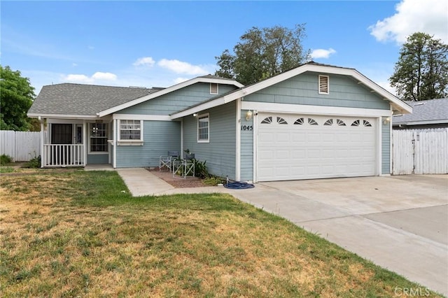 1045 Clover Ln, Hanford, CA 93230 - ranch-style home with an attached garage and driveway