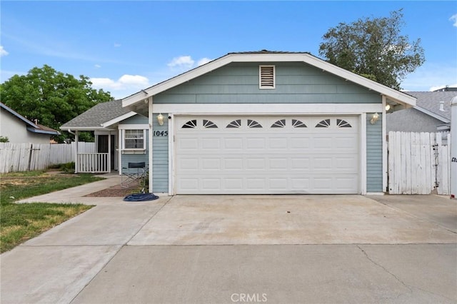 1045 Clover Ln, Hanford, CA 93230 - ranch-style home featuring driveway, fence, and a garage
