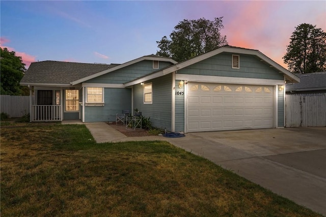 1045 Clover Ln, Hanford, CA 93230 - ranch-style home with an attached garage and driveway