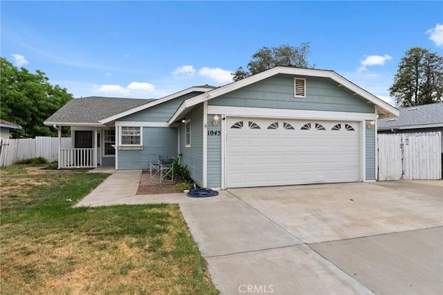 1045 Clover Ln, Hanford, CA 93230 - ranch-style home with concrete driveway and a garage
