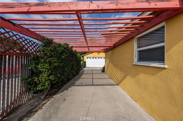 view of property exterior featuring stucco siding and fence