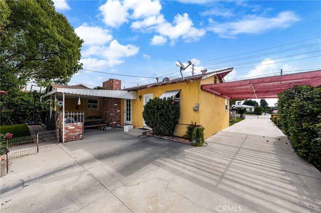 12652 Oaks Ave, Chino, CA 91710 - view of front of home featuring fence and a chimney