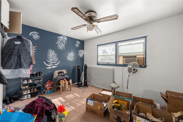 game room featuring a ceiling fan, carpet floors, and cooling unit