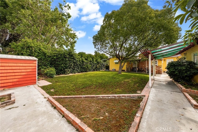 view of green lawn with an outbuilding and a storage shed