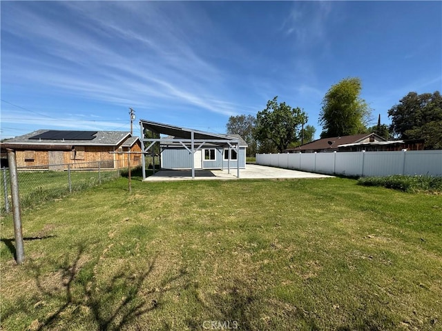 view of yard with a fenced backyard and a patio area