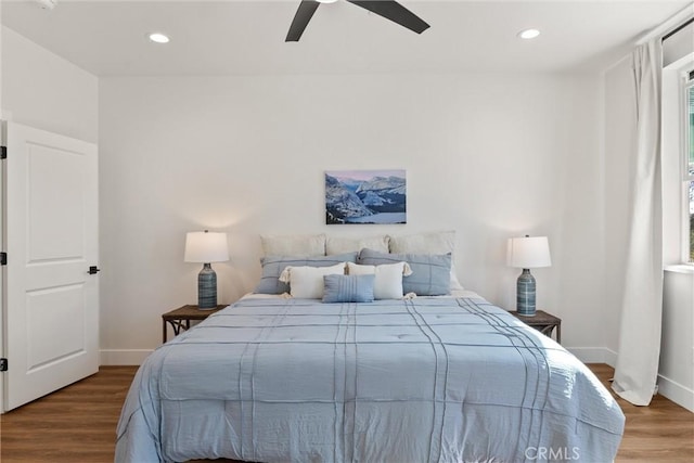 bedroom featuring recessed lighting, a ceiling fan, wood finished floors, and baseboards