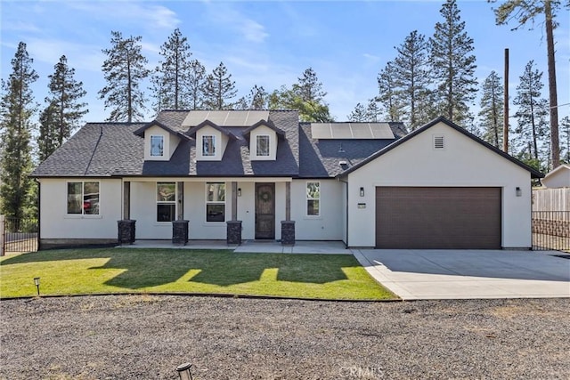 view of front of property with concrete driveway, stucco siding, covered porch, and fence