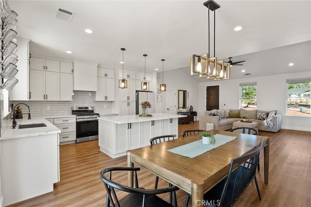 dining room with visible vents, ceiling fan, recessed lighting, and light wood-style flooring